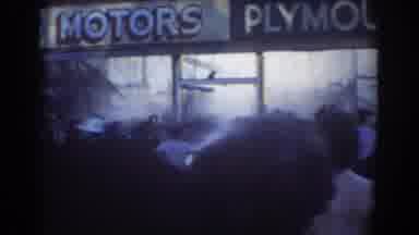 York Nebraska (1958): Firefighters Spray Water In Front Of Plymouth Motors As