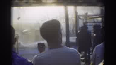 York Nebraska (1958): Several People Watch Other People Pouring Water Out Of Hoses
