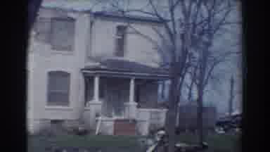 York Nebraska (1958): Dilapidated Buildings With Cars Parked Outside In Grassy