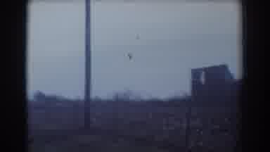 York Nebraska (1958): Passing View Of Damaged Building On A Sunny Day