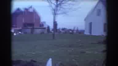 York Nebraska (1958): A Pair Of White Cars Parked By A White House On A Clear