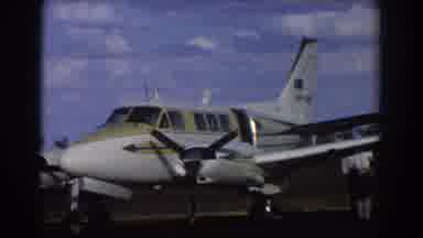 Brisbane Australia (1967): View Of White And Yellow Airplane On A Clear Sunny Day