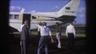 Brisbane Australia (1967): Group Of Men Stand Near White And Yellow Airplane On A