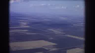 Brisbane Australia (1967): People Boarding Airplane Flying In The Sky Over Land