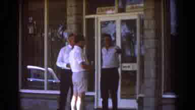 Brisbane Australia (1967): Three Guys Talking In Front Of A Building With A Parked
