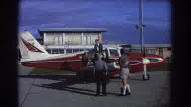 Perth Australia (1967): Men Discussing Business On Red Plane