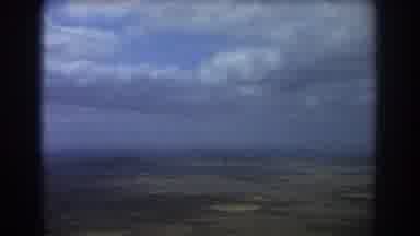 Perth Australia (1967): Plane Flying Over Land In The Clouds