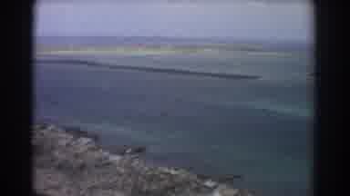 Perth Australia (1967): Flying Over A Watery Marsh Filled With Water Rocks And