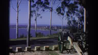 Perth Australia (1967): Black Car Drives By Vintage Cannon Lake And Trees On A