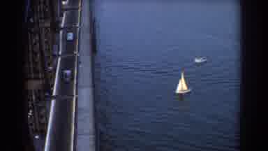 Sydney Australia (1967): Two Sail Boats Moving Along Water Towards A Bridge With