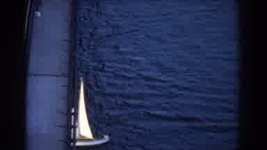 Sydney Australia (1967): Small Boat Moving Slowly Through The Water Passing Under