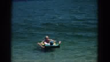 Florida (1957): A Couple On The Water The Woman Is Laid On A Float The Man Is