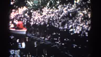 Florida (1957): A Group Of People Boating In A Lake With A View Of Amazing