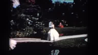 Florida (1957): A Woman In A White Dress Walks Along The Banks Of Cyprus Swamp