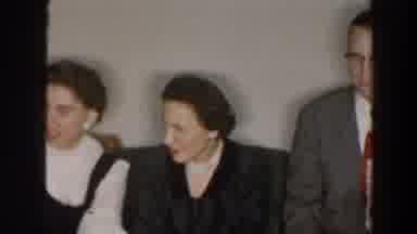 Wheeling Ohio (1957): Two Adult Women And One Adult Man Sit On A Couch With Young