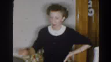 Wheeling Ohio (1957): Middle Aged Woman Interacting Smiling In The Middle Of A