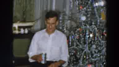 Wheeling Ohio (1957): Man In Chair Talking With Someone By Christmas Tree Setting