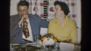 Wheeling Ohio (1957): Woman Wearing Yellow Shirt Sits Next To Man Wearing Grey