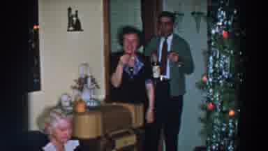 Wheeling Ohio (1957): Man Holds Wine Bottle And Glass In Doorway Near Decorated