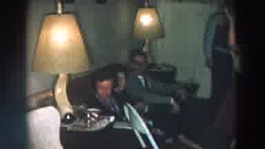 Wheeling Ohio (1957): People Gathered In A Room Of The House Talking And Preparing