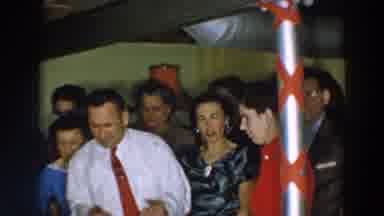 Wheeling Ohio (1957): People Gather Around A Table At A Celebration While Man