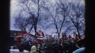 Wheeling Ohio (1957): Person Dressed As Santa Greets Small Children On A Cloudy