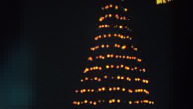Wheeling Ohio (1957): View Of Yellow Revolving Christmas Tree Lights On A Clear