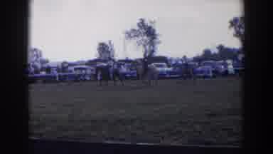 Wheeling Ohio (1957): Men Riding Horses Near A Parking Lot