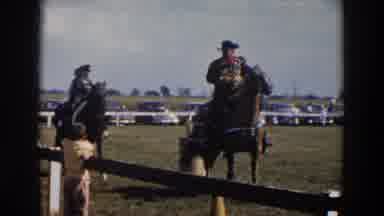 WHEELING OHIO-1957: Cowboys Arrive On Horseback While Woman Watches Followed By