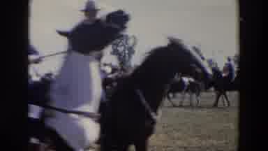 Wheeling Ohio (1957): White Gentleman Ride Horses At An Event Displaying Two Flags