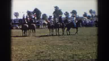 Wheeling Ohio (1957): Horses And Riders Line Up And Slowly Start Trotting Away