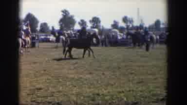 Wheeling Ohio (1957): Participants Prepare For A Horse Racing Competition In An