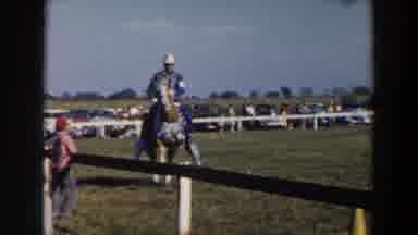 Wheeling Ohio (1957): People Watching Well Dressed Men Riding A Horse Behind A
