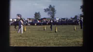 Wheeling Ohio (1957): A Man Jumps On A Horse With Another Man Running Through