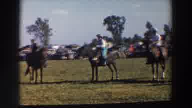 Wheeling Ohio (1957): Row Of Men On Horseback Wait While Horses Flick Their Tails