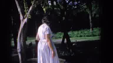 Florida (1958): Woman Wearing White Dress Holding Her Bag Watches The Ducks