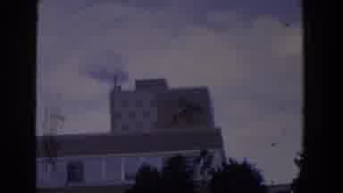 Florida (1958): Front Of An Tannhauser Busch Plant With Smoke Billowing From The