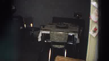 Italy (1958): Table In A Kitchen With Chairs Around And A Red Light At The Top Of