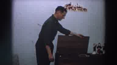 Italy (1958): A Man Showcasing His Skills Which Is Opening A Box In Front Of A