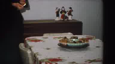 Italy (1958): View Of White Decorated Dining Table And Brown Wooden Sideboard