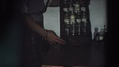 Italy (1958): Woman Shows Her New Bottle Holder