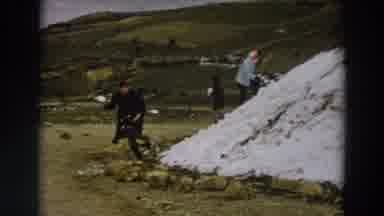 Italy (1958): On The Lawn There Is A Layer Of Snow And Three People Play Snow War