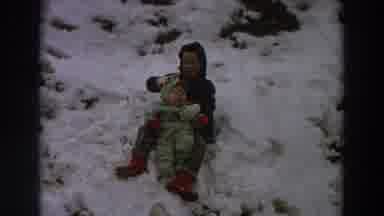Italy (1958): A Kid With A Baby Playing On A Snow Covered Hill Looks Like An Old