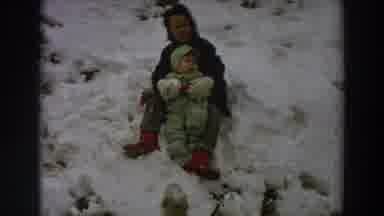 Italy (1958): Child And Baby Playing In Snow With Village Scenery Of Houses