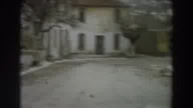 Italy (1958): Approaching View Of Yellow And Green Building On A Clear Day