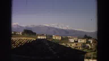 Italy (1958): View Of Small White Houses On Green Mountain Side On A Sunny Day