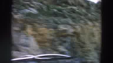 Italy (1958): Car Travels Along Dirt Road Overtaking Man Riding Horse And Buggy