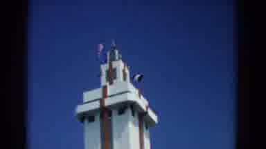 South Carolina (1958): French Flags Hoisted In A White Building With A Blue Sky In