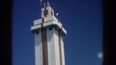 South Carolina (1958): View Of A Tower Building With Flags Blowing On A Beautiful