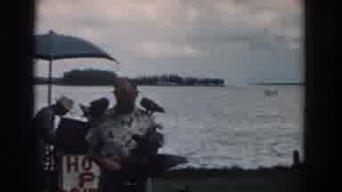 South Carolina (1958): Large Birds On Man Standing Near Man At Concession Stand